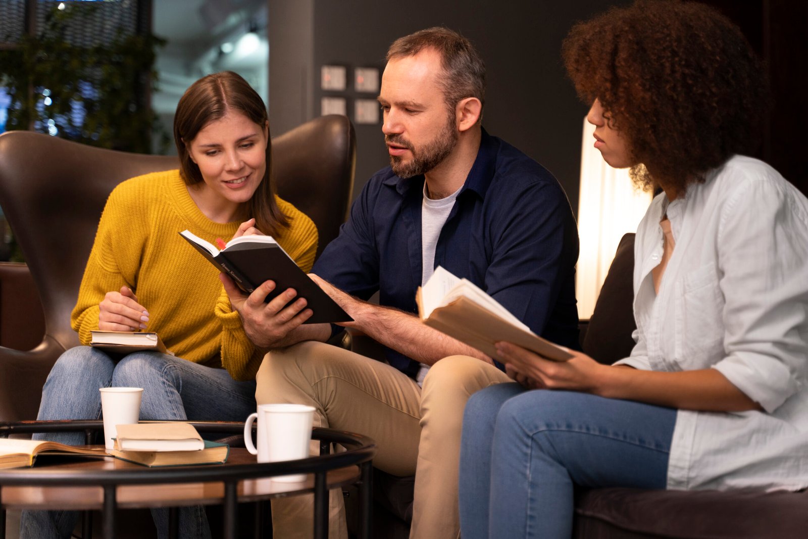 side-view-people-reading-together